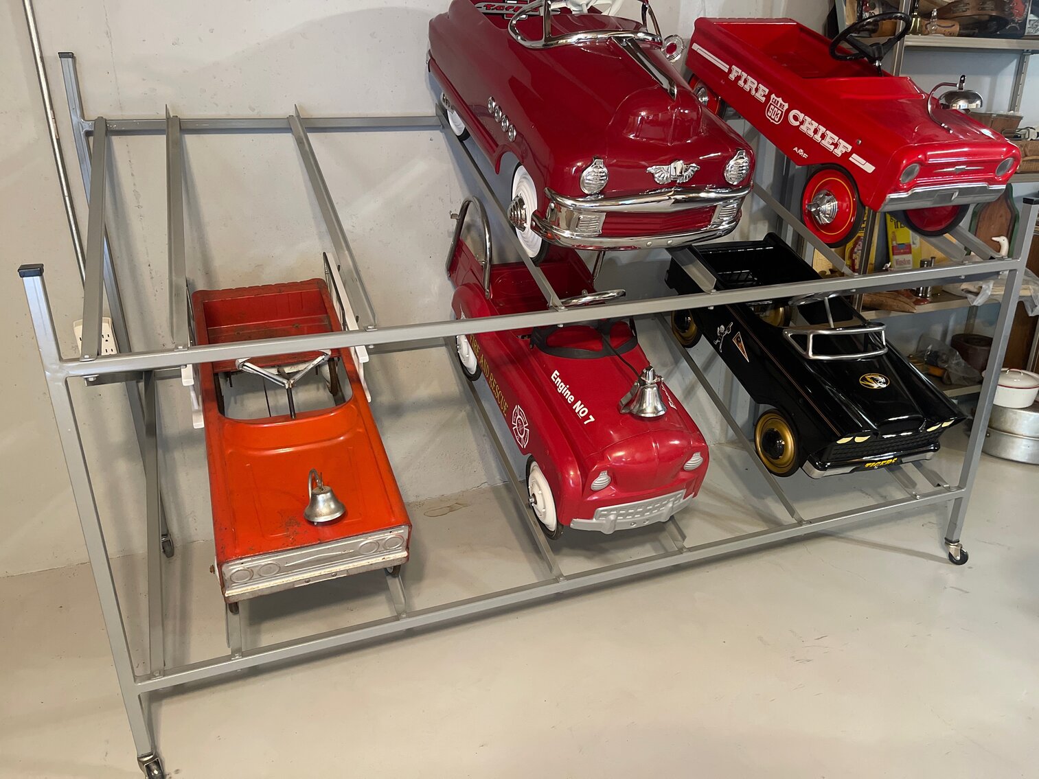 Storage rack for Pedal Car Collection.  Holds 6 pedal cars.