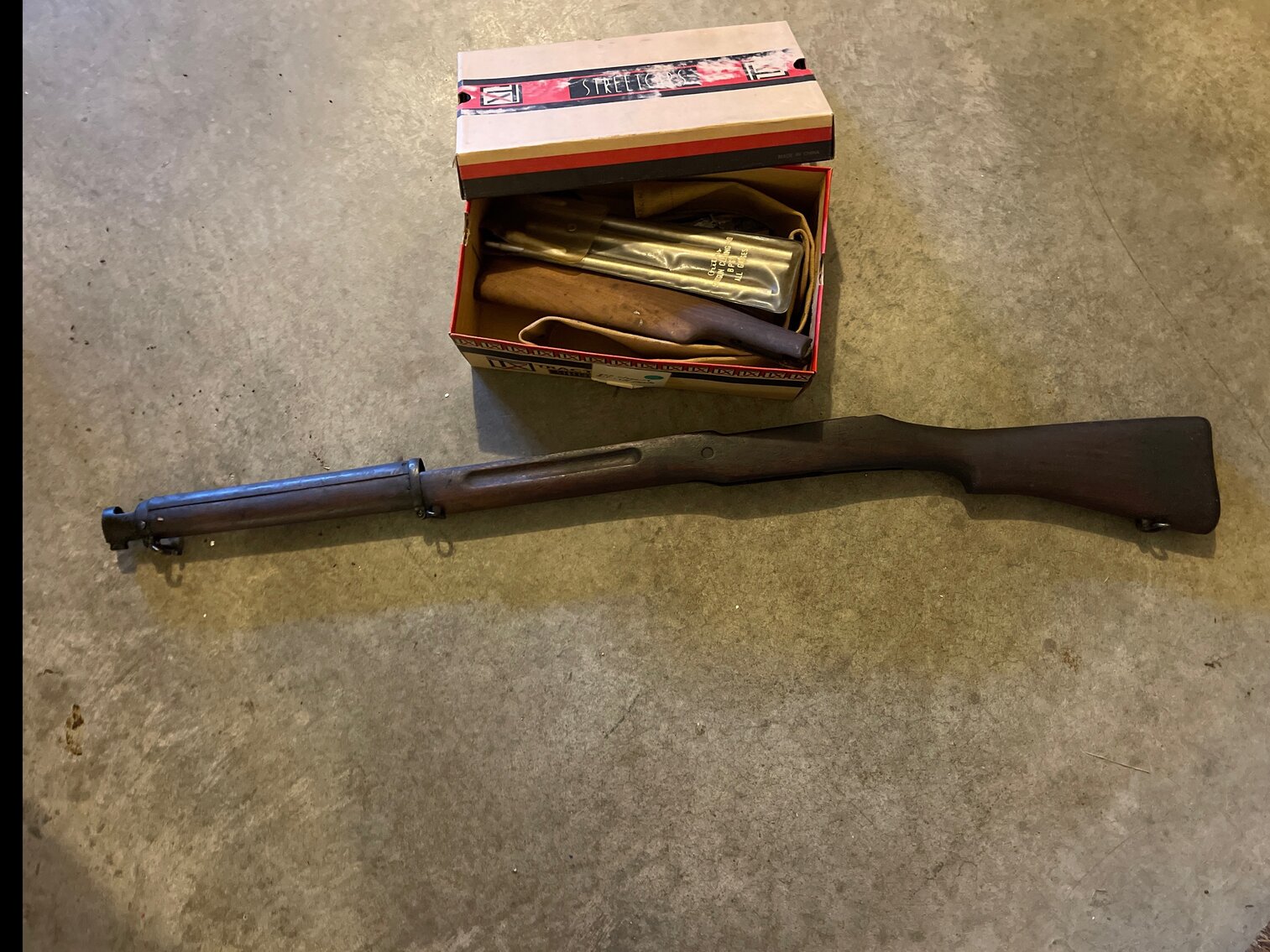Gun stock and box with gun cleaning kit and parts