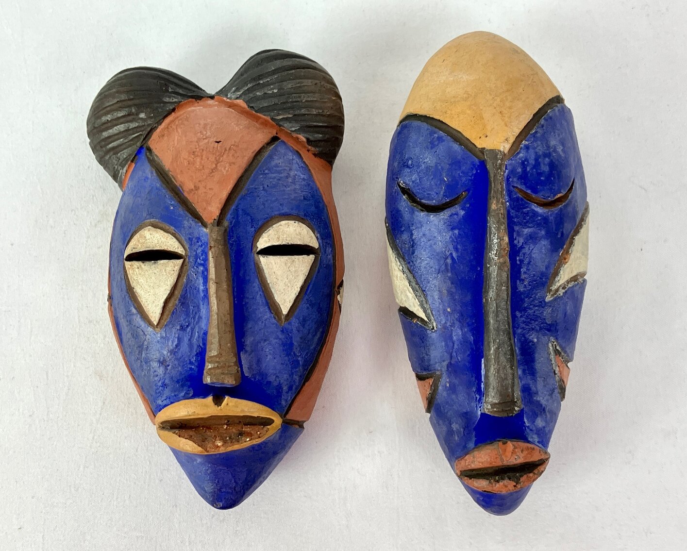Two Small Clay Painted African Masks