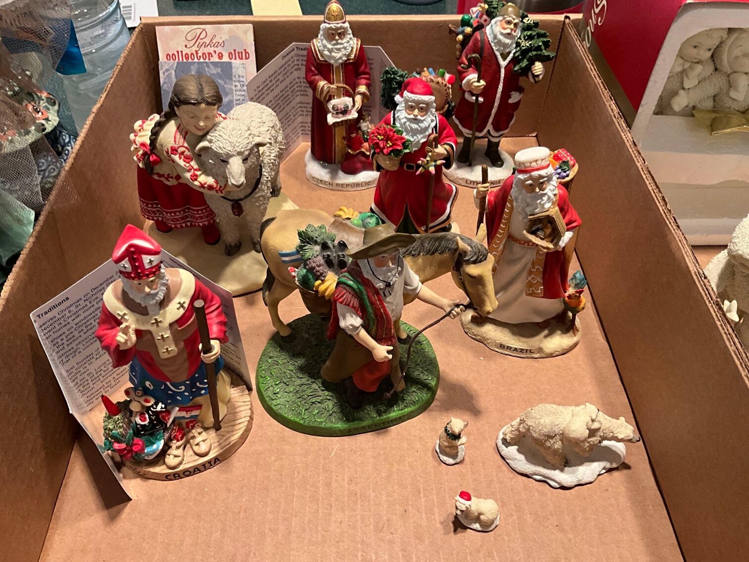 K- (7) Large Pipka “World of Santas” Figurines and (3) Small Pipkas