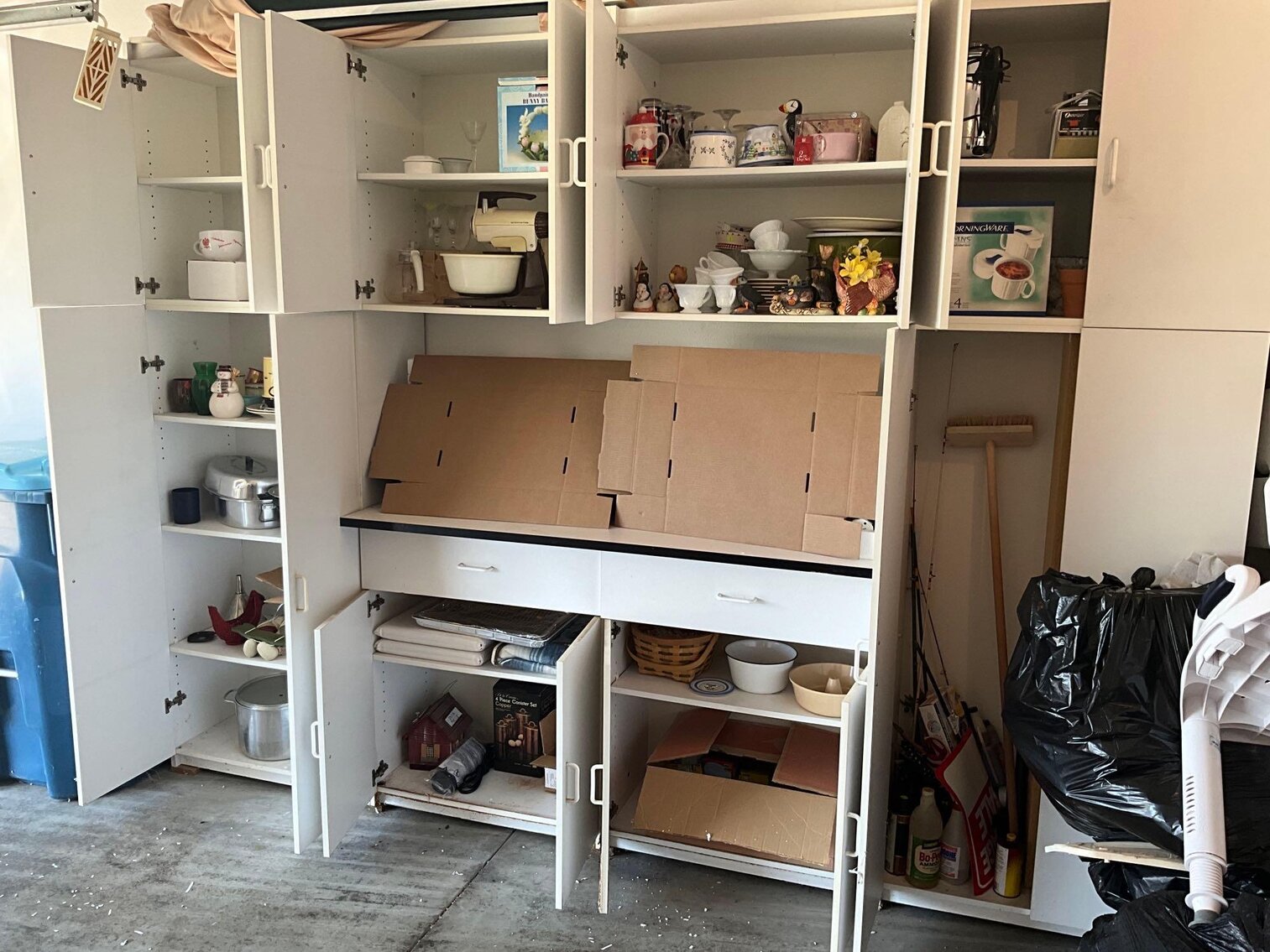G- Contents of White Garage Cupboards