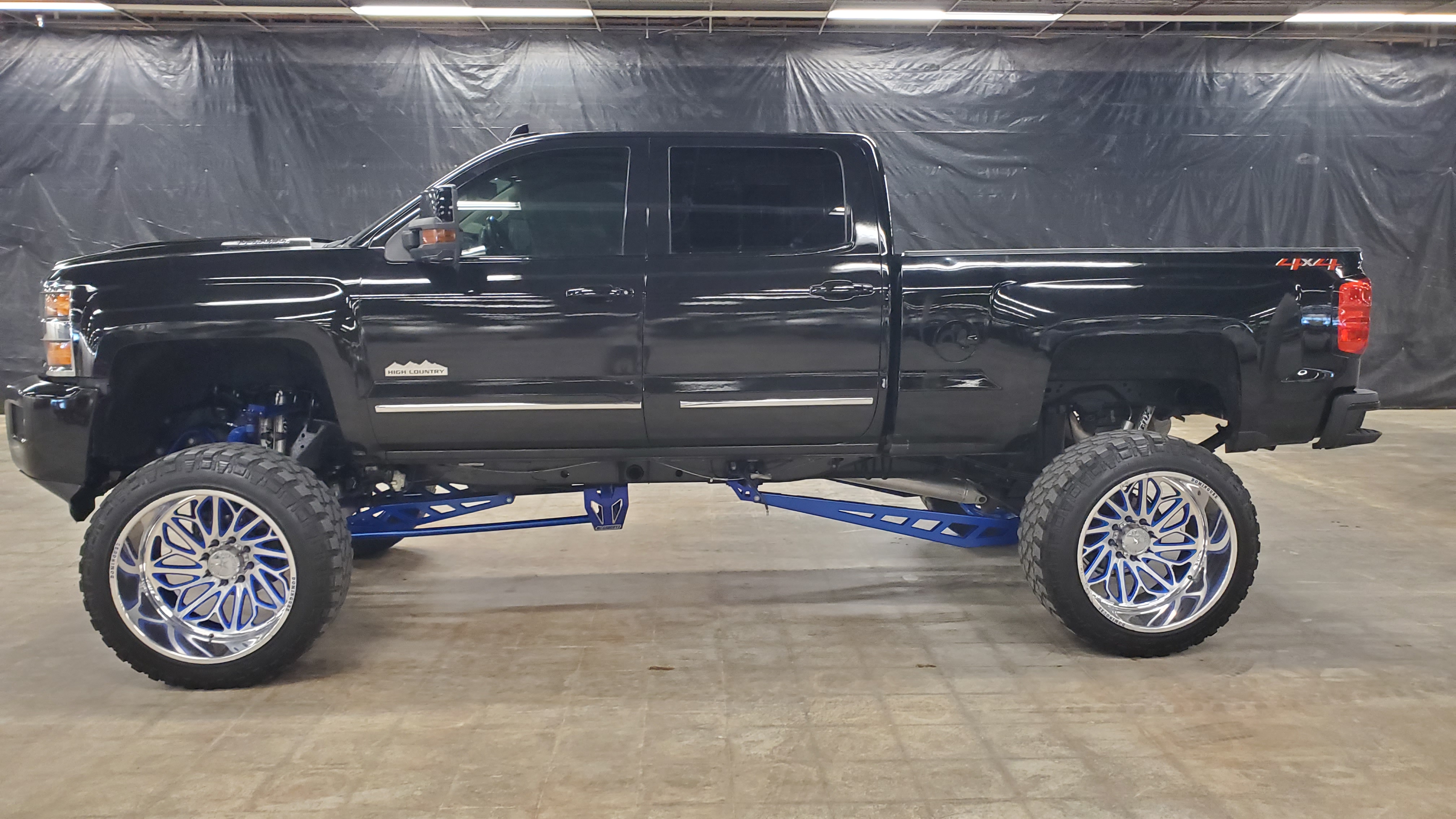 2019 Chevrolet Silverado 2500HD High Country Crew Cab 4x4 on a blue lifted suspension