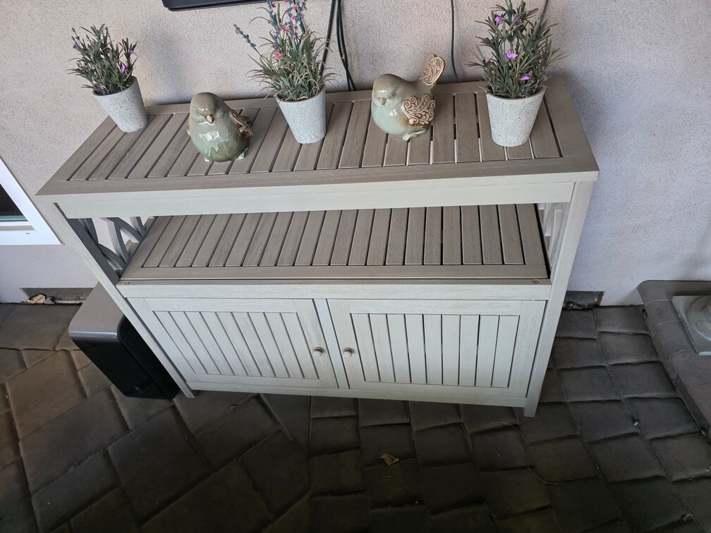 Wooden Cabinet Includes Decor Sitting On It