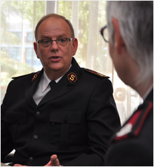 General Cox speaking with Major Jane Kimberley