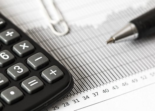 calculator and paperwork lay the foundation on tax tips for restaurants