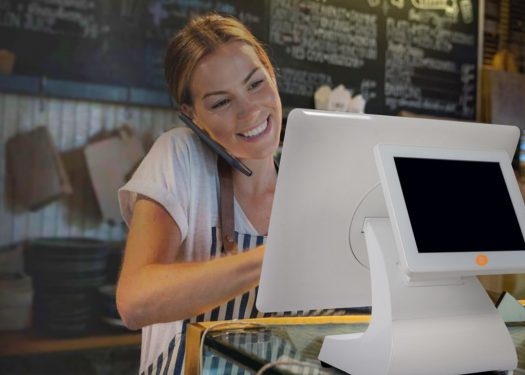 Restaurant employee using a new POS System they just bought.