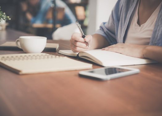 Restaurant employee creating a strategy to manage restaurant online presence
