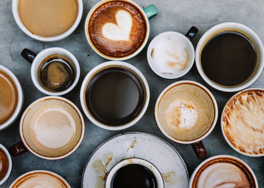various coffee styles laid on tabletop including top coffee trends