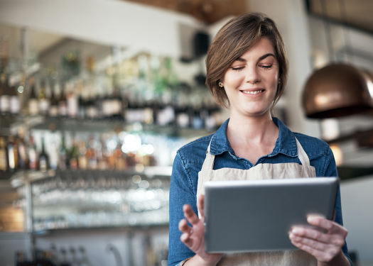 Server taking an order table-side, one of the benefits of a cloud-based POS