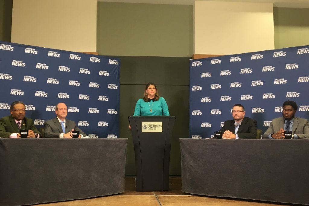 At the final Hometown Debate, Tuesday, October 16, in Gastonia, from left, Rep. Kelly Alexander, D-Mecklenburg; Sen. Dan Bishop, R-Mecklenburg; moderator Loretta Boniti of Spectrum News; Americans for Prosperity state director Chris McCoy; and N.C. Justice Center analyst Brian Kennedy. (CJ photo by Will Rierson)