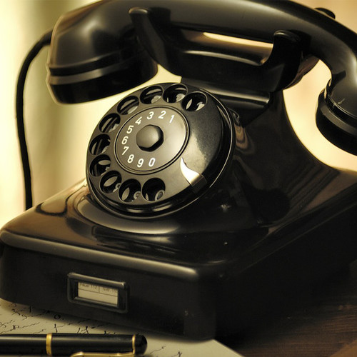 Old Telephone Bell Cover Art Blurred Background