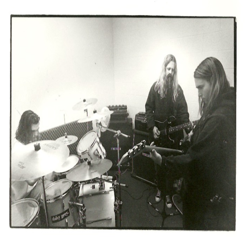Daisy Grey + 7" (Remastered) Cover Art Blurred Background