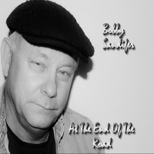 At The End Of The Road Cover Art Blurred Background