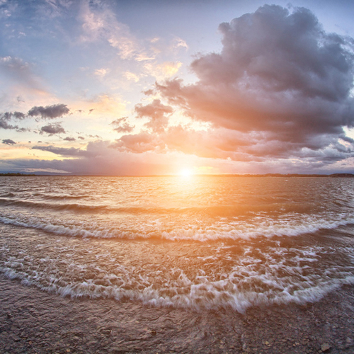Small Lake Waves Lapping on Beach Cover Art Blurred Background