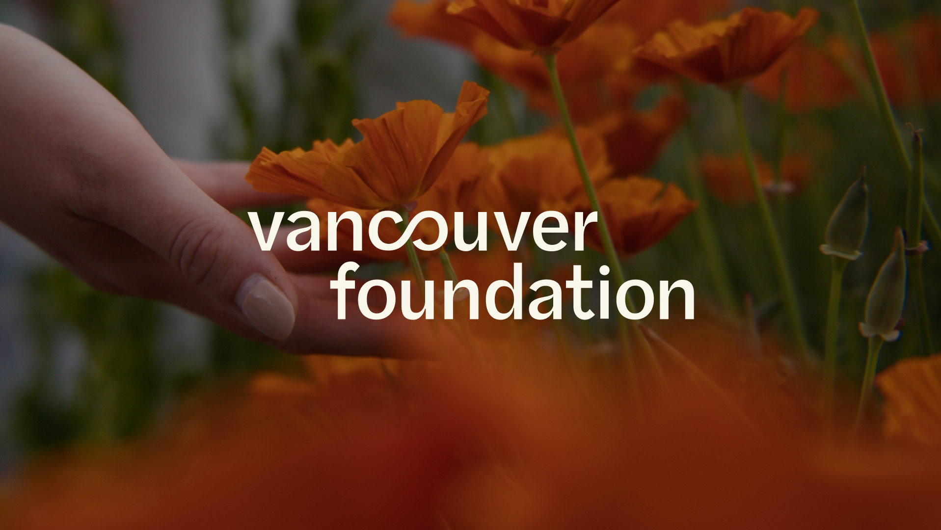 Vancouver Foundation logo over a close-up photograph of orange flowers and a person tending the garden.
