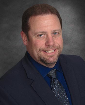 Headshot of Ken Roth