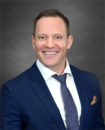 Headshot of Darik Tolnay