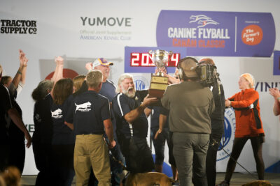 People celebrating their Flyball CanAm Classic win