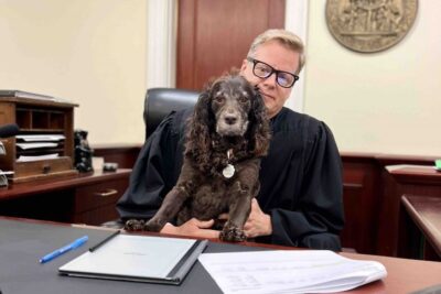 Judge Joe Wyant and Scout enjoy a few moments together between cases at the Coweta County (Georgia) Juvenile Court.