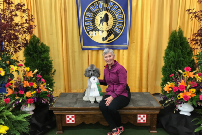 Connie and her poodle at an agility event.