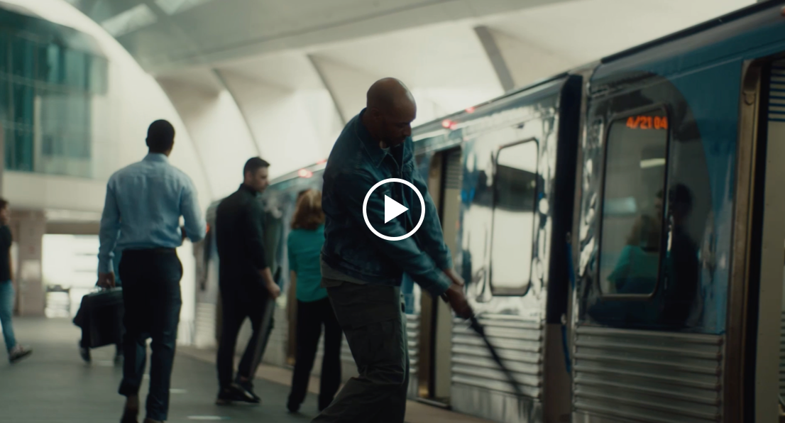 Video Still a man playing a golf beside the train