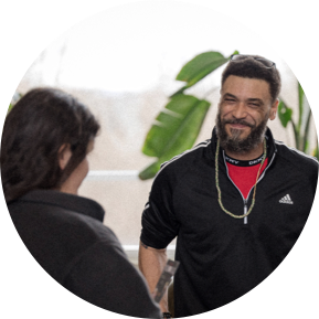 Smiling bearded man talking to woman