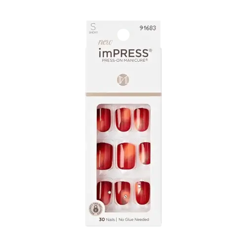 A package of imPRESS press-on nails in a short square shape in a burnt red ombre design