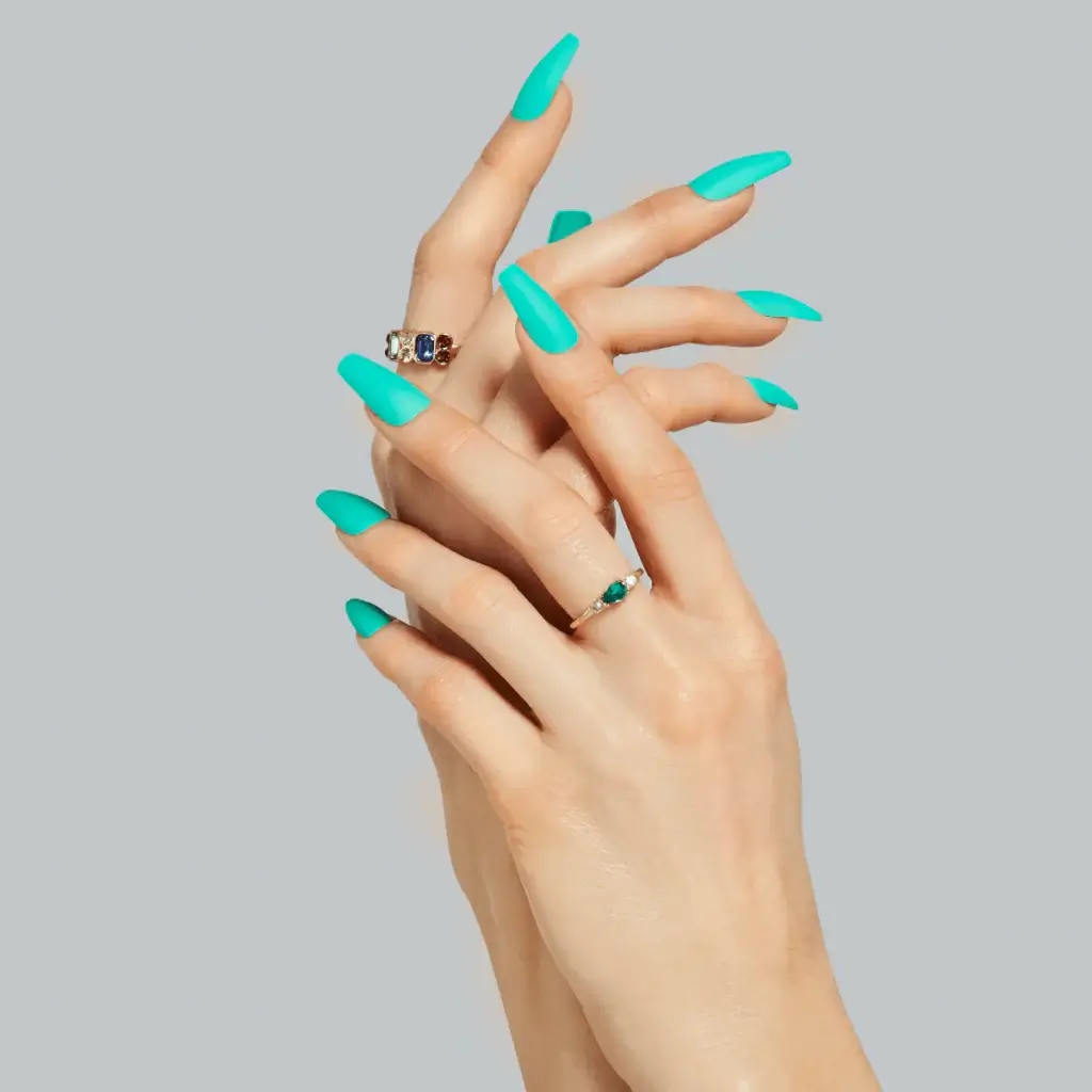 2023-09-13_dd32bce9-4c2b-4c42-8cbd-d264f4e84d8a | BEAUTIFY.TIPS A set of hands, modeling long coffin shaped nails manicured in a bright turquoise color