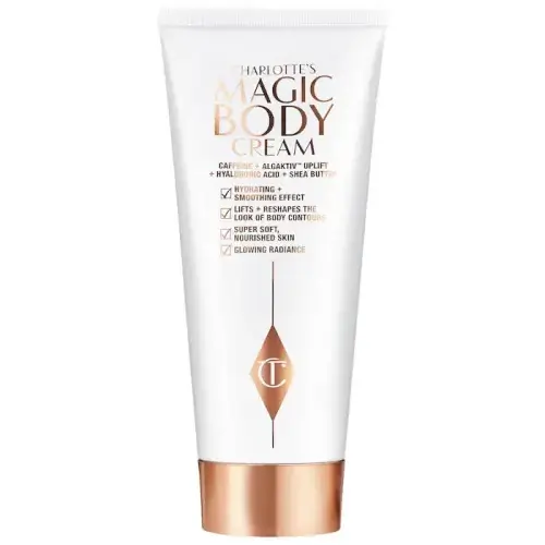 A tube of charlotte's magic body cream with product benefits listed on the packaging.