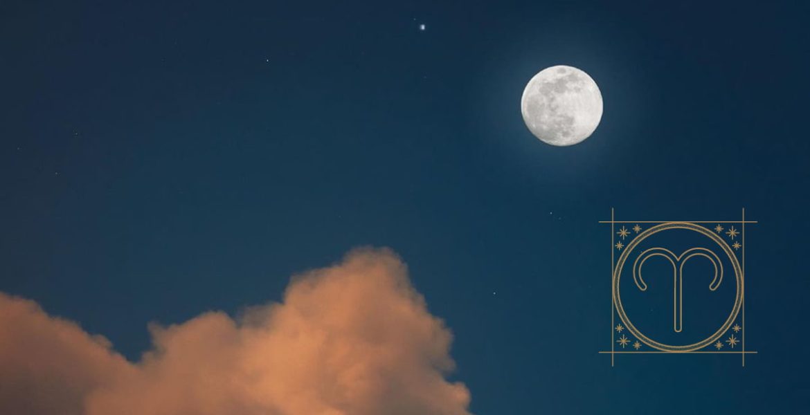 Imagen de la luna nueva en el cielo azul, con el signo de aires