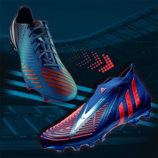 Un par de tenis de fútbol Adidas Predator 2025 en colores azul y naranja, destacando su diseño innovador para máximo control y precisión en el campo.
