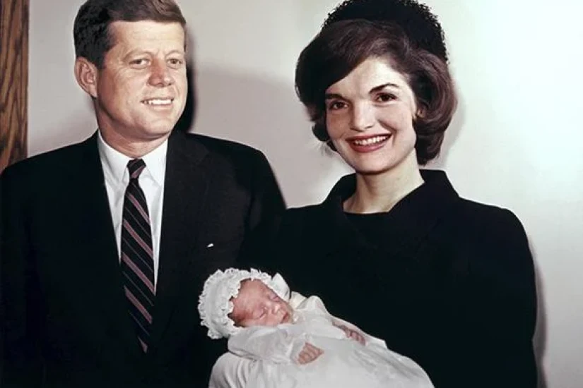 President John F. Kennedy, his wife, Jackie, and their son John Jr. on his Christening day, Dec. 8, 1960.