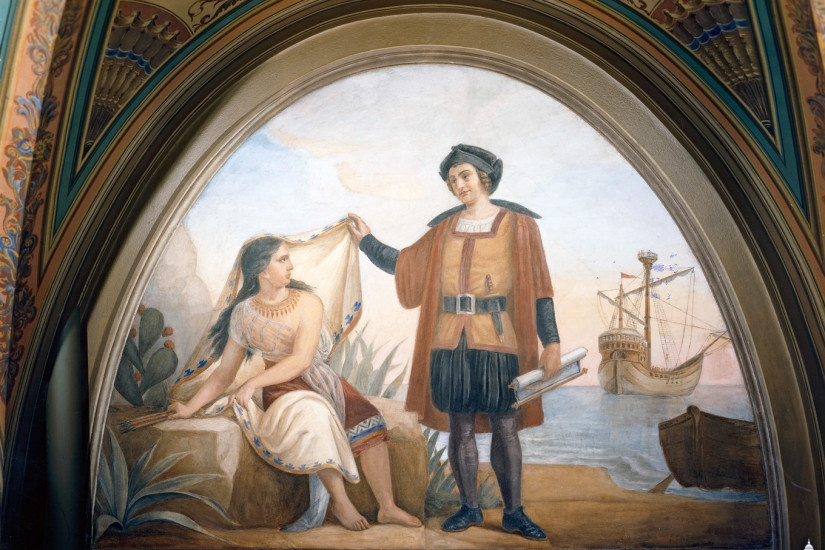 Columbus lifting the veil of an apprehensive Native American woman and smiling down at her, his ship in the background.