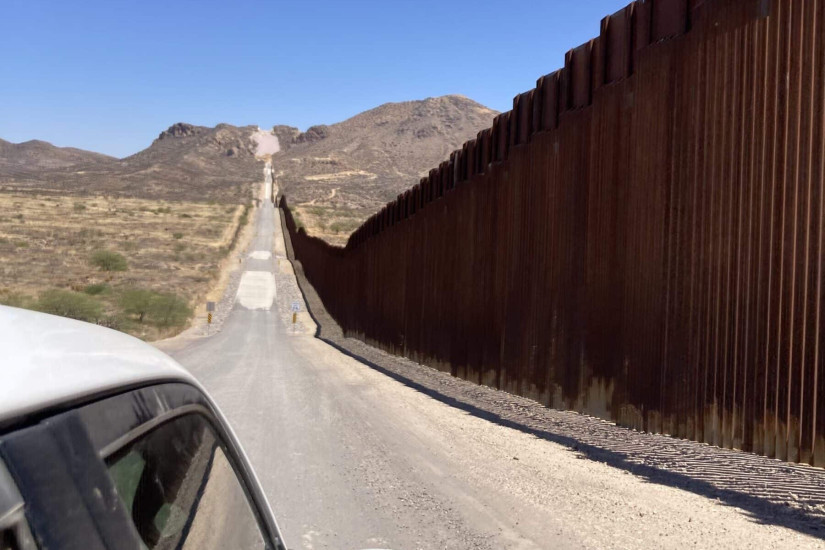 Driving along the border wall, May 2025.