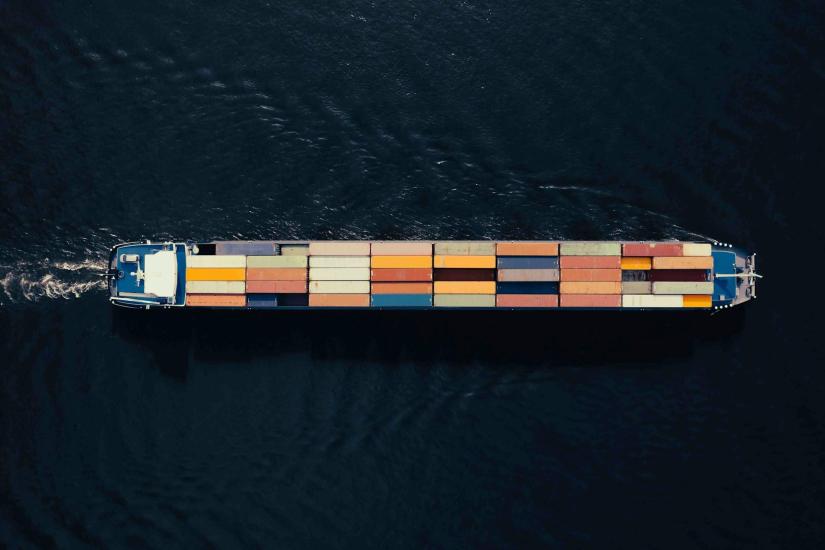 Aerial view of a container ship in the water.