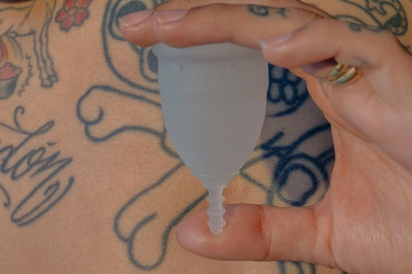 Hand holding menstrual cup