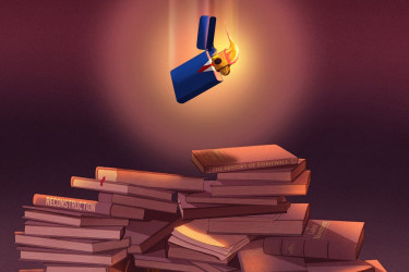 Lighter falling onto a pile of books.