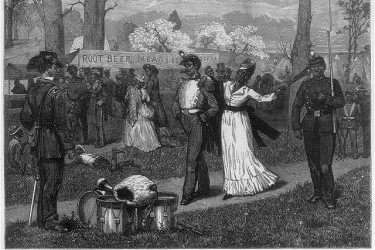 Black soldiers and well-dressed women walking proudly in a military camp.