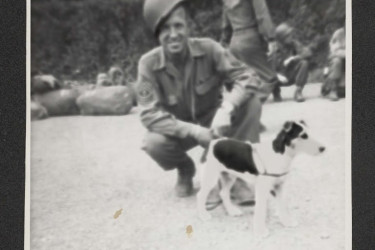 A veteran and a dog.
