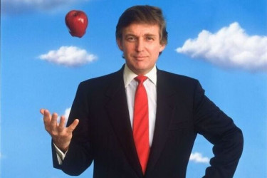 A young Donald Trump tosses an apple into the air.