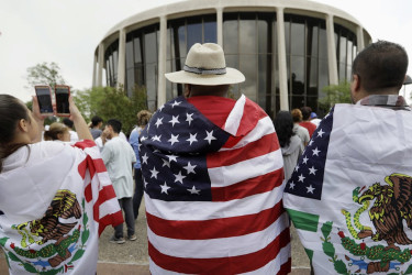 Protesters wrapped in American and Mexican flags oppose an anti-sanctuary bill outside in San Antonio in 2017.