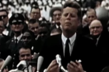 Photograph of JFK speaking to a crowd.