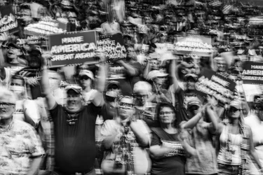 Black and white image of a MAGA rally.