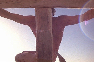 Still from the "Last Temptation of Christ" depicting Jesus on the cross.