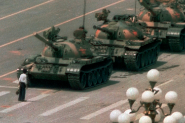 Student stands in front of tanks in Tiananmen Square