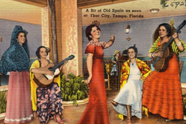 A postcard showing five women in colorful dresses playing and singing in Ybor City