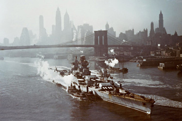 The French battleship Richelieu being maneuvered by tugboats up the East River for repairs and refitting.