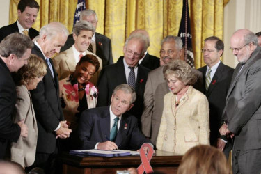 George W. Bush signs a bill that extends PEPFAR, July 2008.