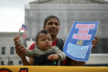 A mother and son at a protest outside of the U.S. Supreme Court.