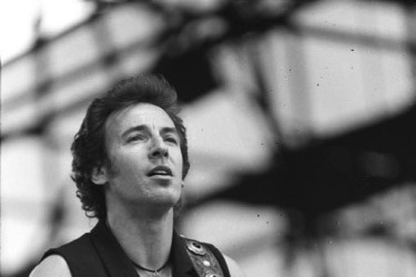 Bruce Springsteen playing the guitar.